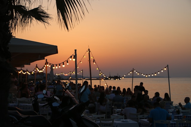 Summer night in Greece with palm trees and lights